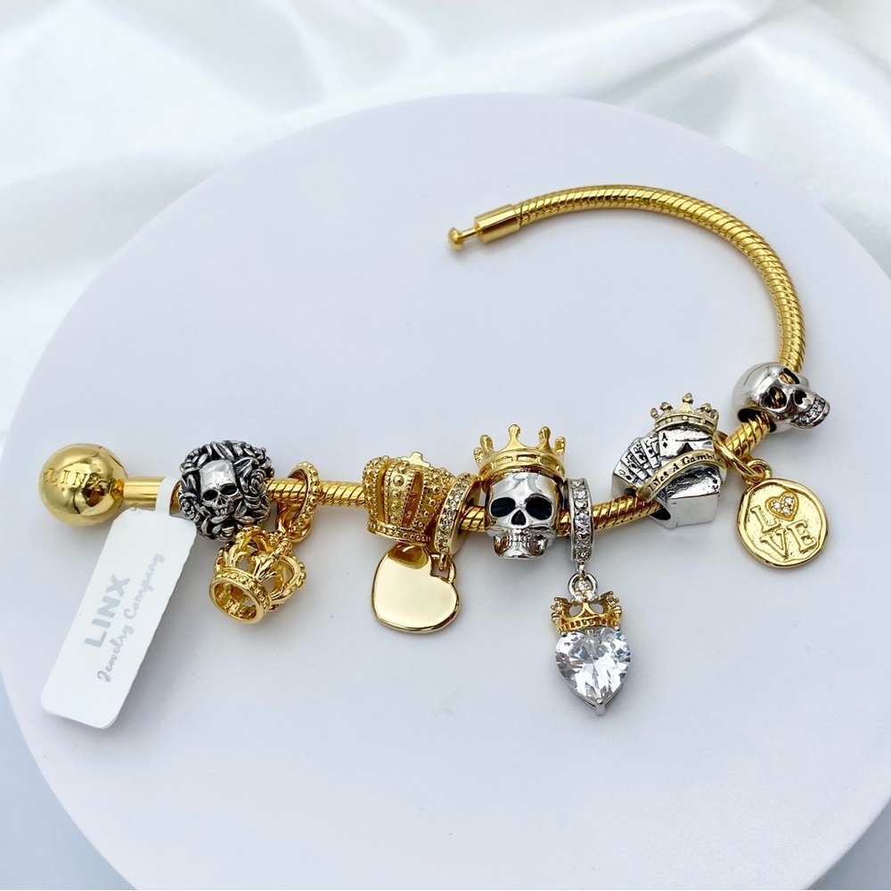Linx Yellow Gold Snake Chain Bracelet with Royal Skull Themed Charms
